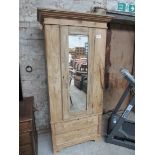 Pine single wardrobe with mirror door and 2 drawers to base.