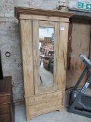 Pine single wardrobe with mirror door and 2 drawers to base.