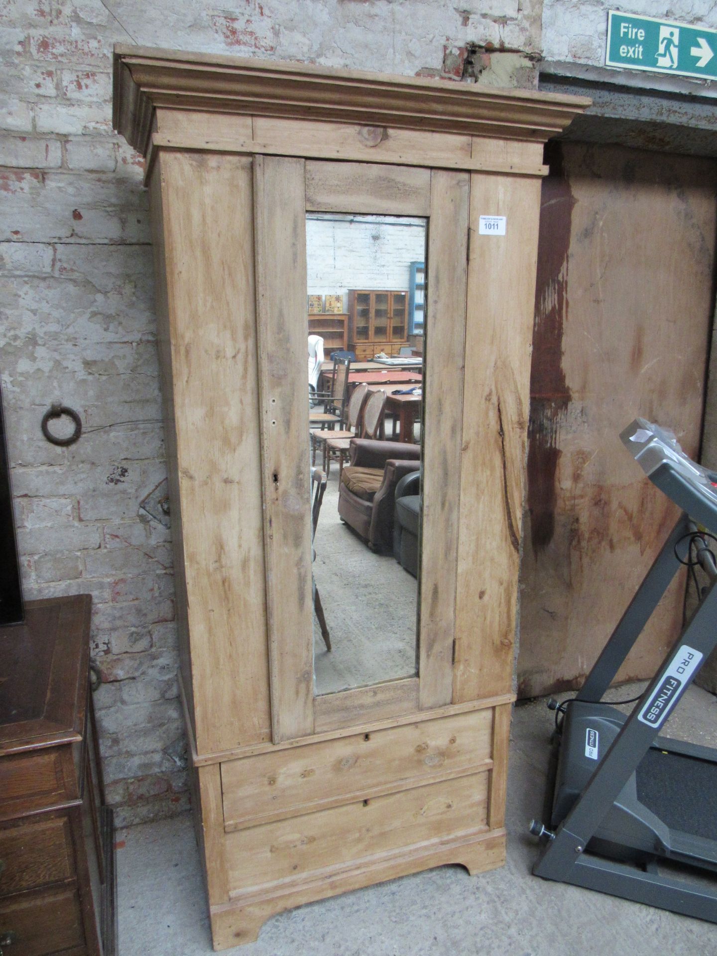 Pine single wardrobe with mirror door and 2 drawers to base.