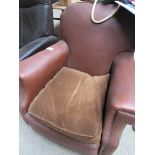 Brown faux leather armchair.
