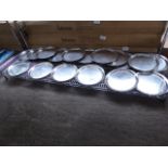 20 round stainless steel trays. Estimate £20-25.