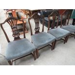 4 dining chairs with upholstered seat.