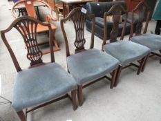 4 dining chairs with upholstered seat.