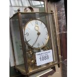 6 various pictures and a carriage clock.