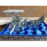 Silver coloured metal model of a donkey and carriage