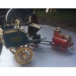 Four small models - Hansom Cab, Dog Cart, a Fire Engine, and a Model of a Dairy Cart and milkman