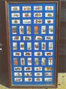 A framed display of fifty John Player & Son cigarette cards depicting firefighting applicances