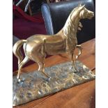 Heavy antique brass model of a horse in trot