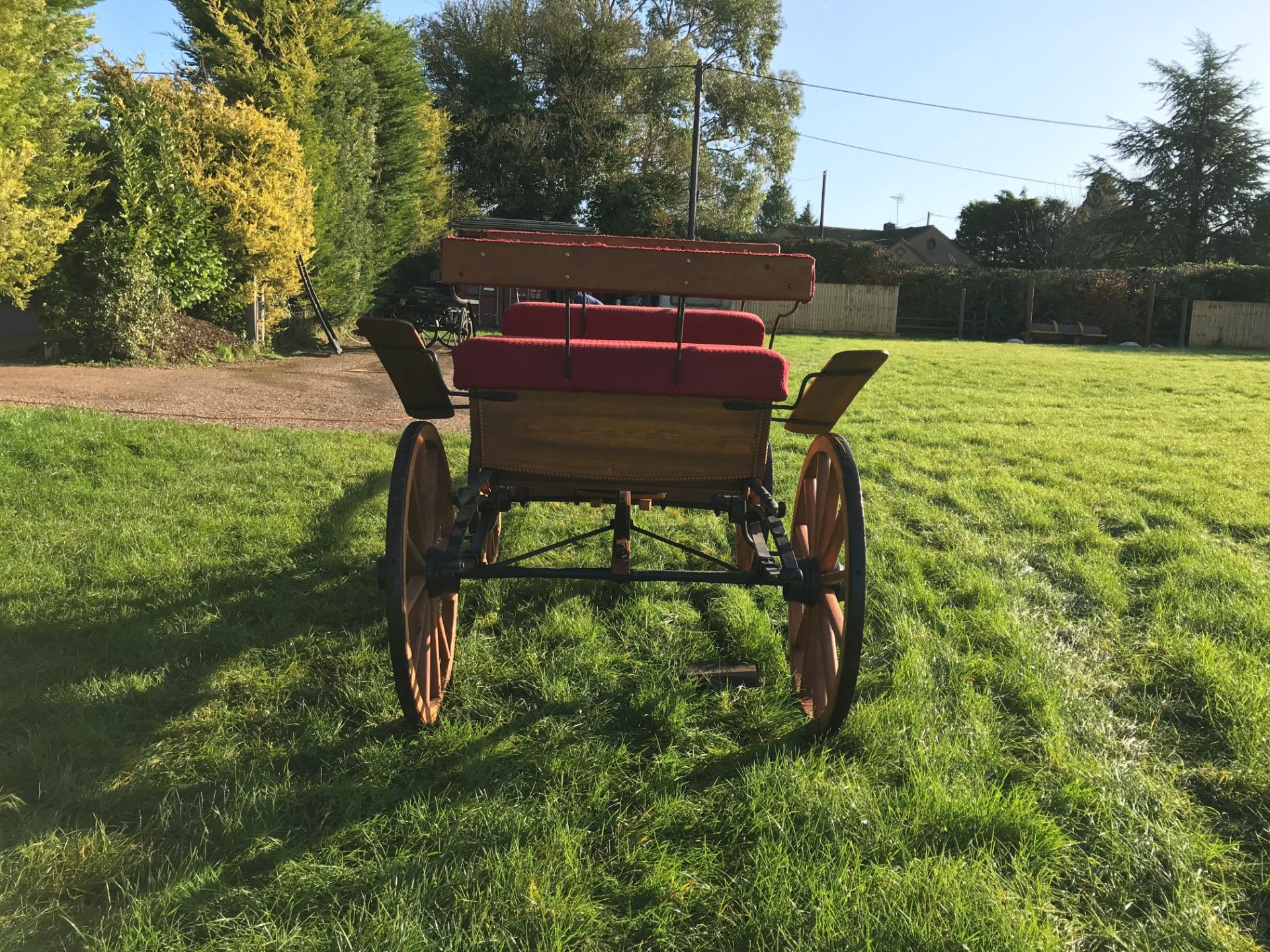 FOUR-WHEEL PLEASURE VEHICLE finished in natural varnished wood edged in carved detailing, and red - Image 2 of 3