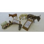 Three enamel models - Gypsy Wagon; donkey and a horse, along with a whitemetal mule money box and