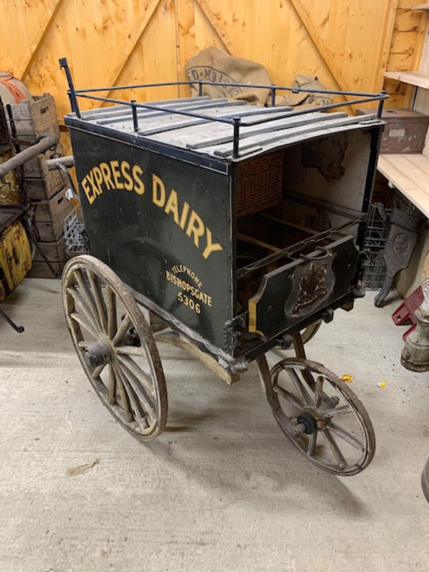 MILK PRAM with wooden body on 3 metal shod wheels. In original condition, sign written 'Express - Image 2 of 2