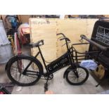 BAKER'S PUSH BIKE painted black with metal front cage for a breadbasket and sign written 'Co-