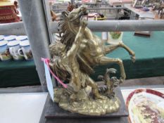 Brass model on a plinth of a rearing horse with handler, 16ins high x 12ins wide