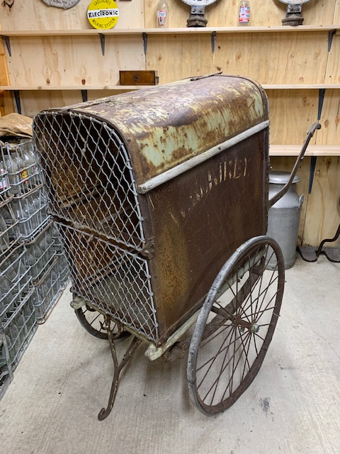 TWO-WHEEL METAL COVERED DAIRY CART on spoked wheels with iron treads. Fitted with carry handles