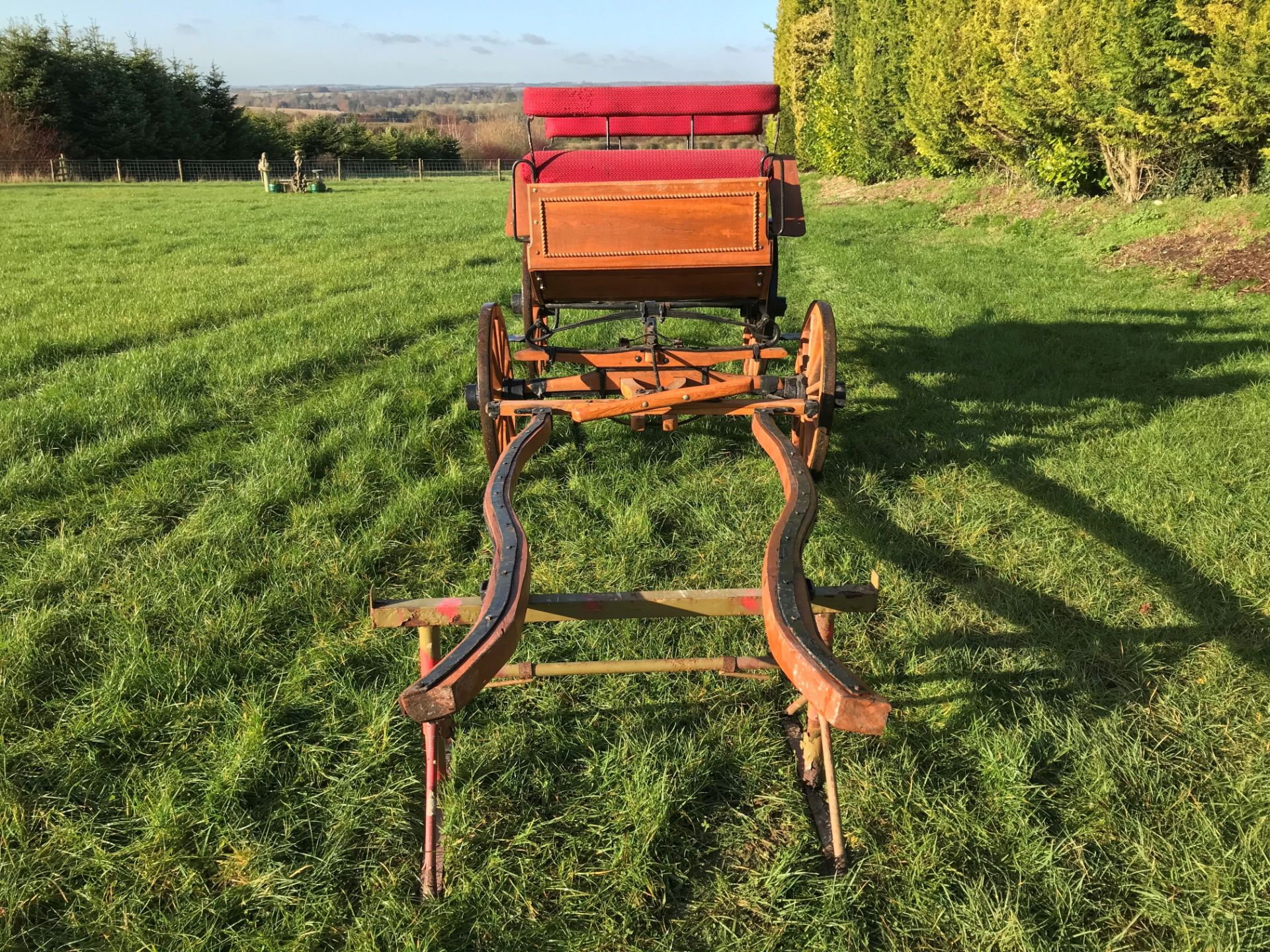 FOUR-WHEEL PLEASURE VEHICLE finished in natural varnished wood edged in carved detailing, and red - Image 3 of 3