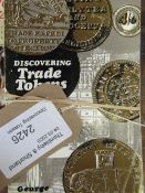 Six various books on Discovering Trade Tokens