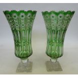 A pair of large green glass vases to suit a Gypsy Wagon. Height 43 cms