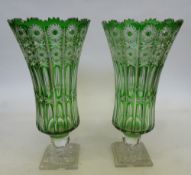 A pair of large green glass vases to suit a Gypsy Wagon. Height 43 cms