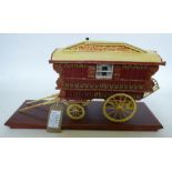 A fine model of a Ledge Wagon painted and decorated in red and yellow. Fitted with a mollicroft