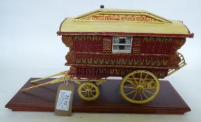 A fine model of a Ledge Wagon painted and decorated in red and yellow. Fitted with a mollicroft