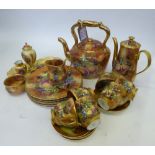 China tea set for a Gypsy Wagon, a teapot and a biscuit barrel in the shape of a Gypsy Wagon
