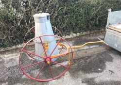 CARRY CART with a 17 gallon milk churn with yellow painted frame on red painted metal 8-spoke