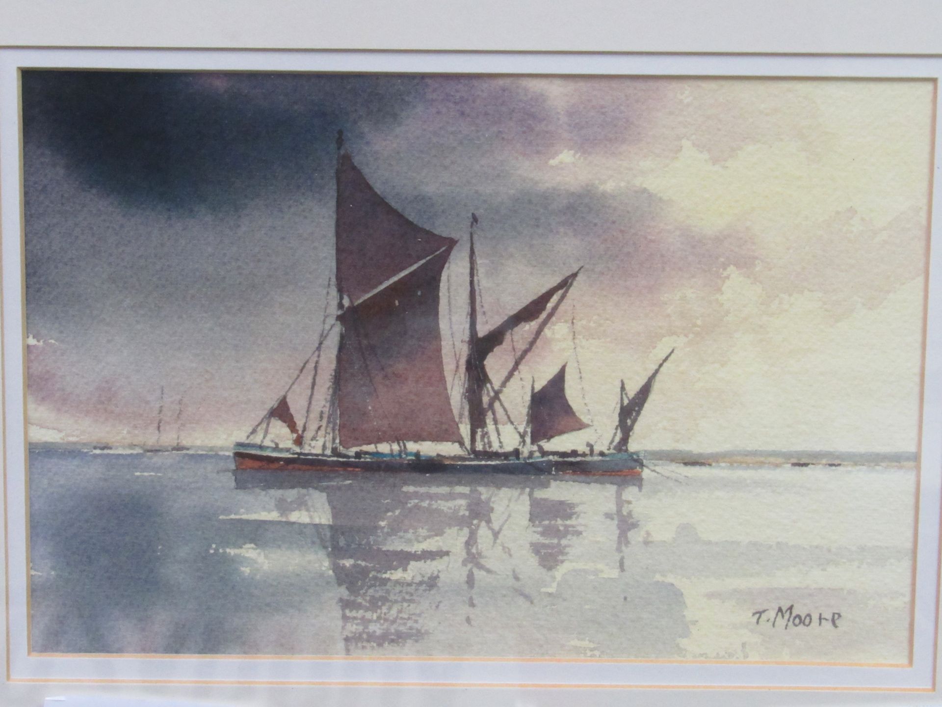 Framed and glazed original watercolour of Thames Barge signed Thomas Moore. Estimate £30-40.