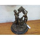 Large bronze figural set of 3 Bacchanalian nude boys on marble base. Estimate £60-90.