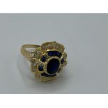 18ct gold sapphire and diamond cluster ring 6.5gms, size N. Estimate £850-900.