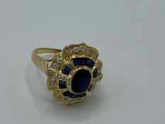 18ct gold sapphire and diamond cluster ring 6.5gms, size N. Estimate £850-900.