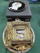 2 sets of place mats; 2 wall hanging roundels; 4 small gilt framed pictures. Estimate £10-20.