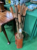 Collection of primitive fletched arrows in modern leather quiver. Estimate £60-90.