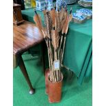 Collection of primitive fletched arrows in modern leather quiver. Estimate £60-90.