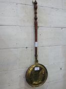 Brass and copper long handled bed warming pan. Estimate £10-20.