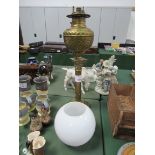 Brass table lamp complete with glass shade. Height 74cms. Estimate £20-30.