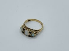 9ct gold opal and sapphire ring, size P, weight 3.5gms Estimate £150-180.