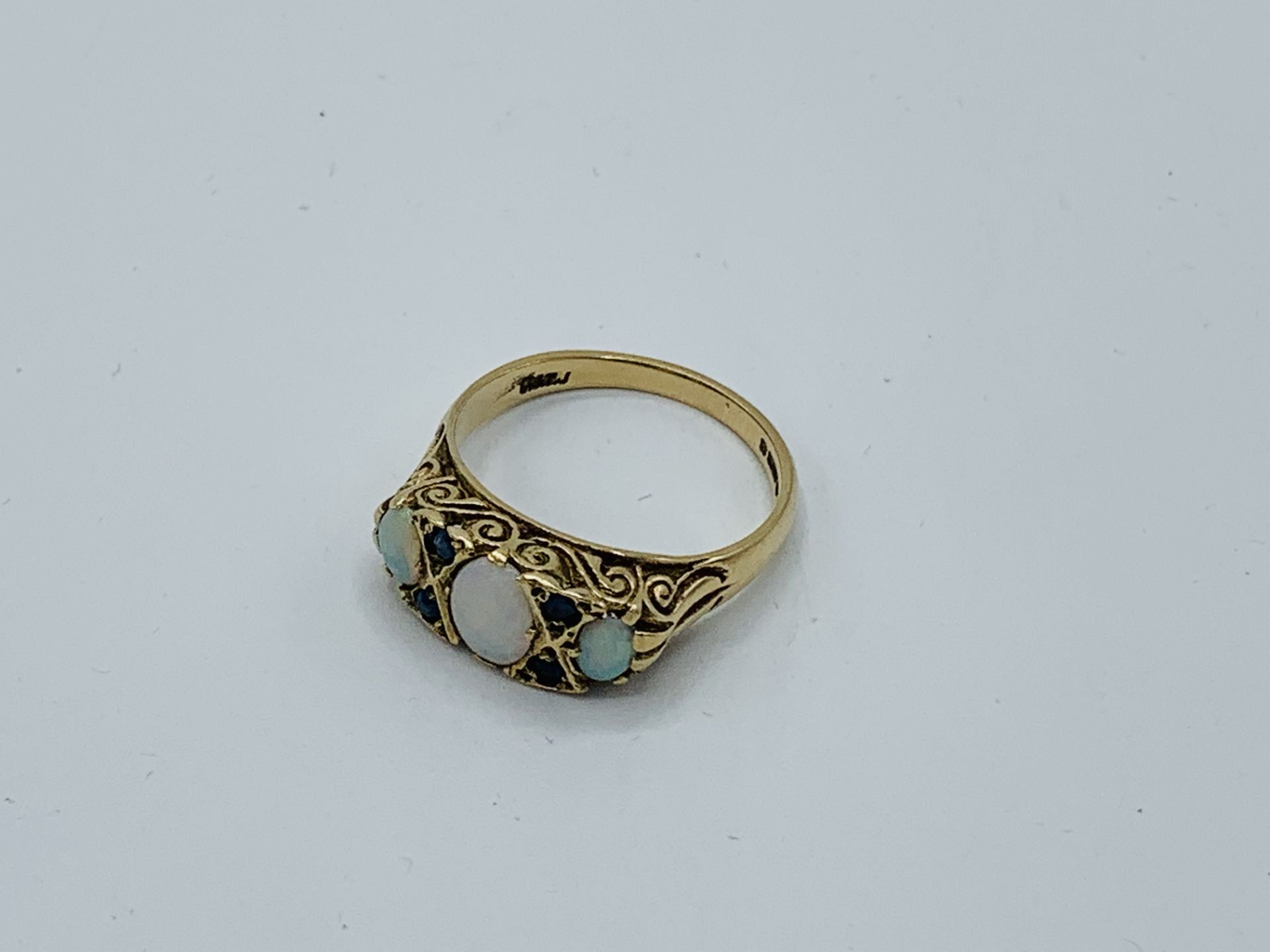 9ct gold opal and sapphire ring, size P, weight 3.5gms Estimate £150-180.