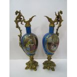 Pair of French ormolu mounted porcelain ewers, height 38cms. Estimate £40-60.