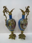 Pair of French ormolu mounted porcelain ewers, height 38cms. Estimate £40-60.