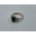 9ct gold ring with centre black opal and diamond either side, weight 2.5gms, size L 1/2. Estimate £