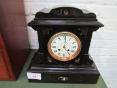 Polished slate mantel clock with marble inserts. 2 drum movement. Going order. Estimate £40-50.