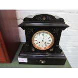 Polished slate mantel clock with marble inserts. 2 drum movement. Going order. Estimate £40-50.