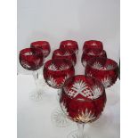 7 ruby cut to clear Hoch glasses and 2 other similar. Estimate £50-80.