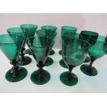 Set of 6 handmade dark green wine glasses together with 5 others (2 as found). Estimate £50-80.