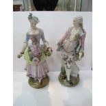 Pair of Dresden figures in 18th Century costume, one as found, height 37cms. Estimate £50-100.