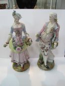 Pair of Dresden figures in 18th Century costume, one as found, height 37cms. Estimate £50-100.