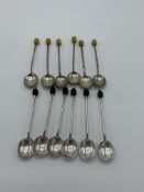 2 sets of 6 silver coffee bean spoons both hallmarked Sheffield, 1934 & 1920. Estimate £30-40.