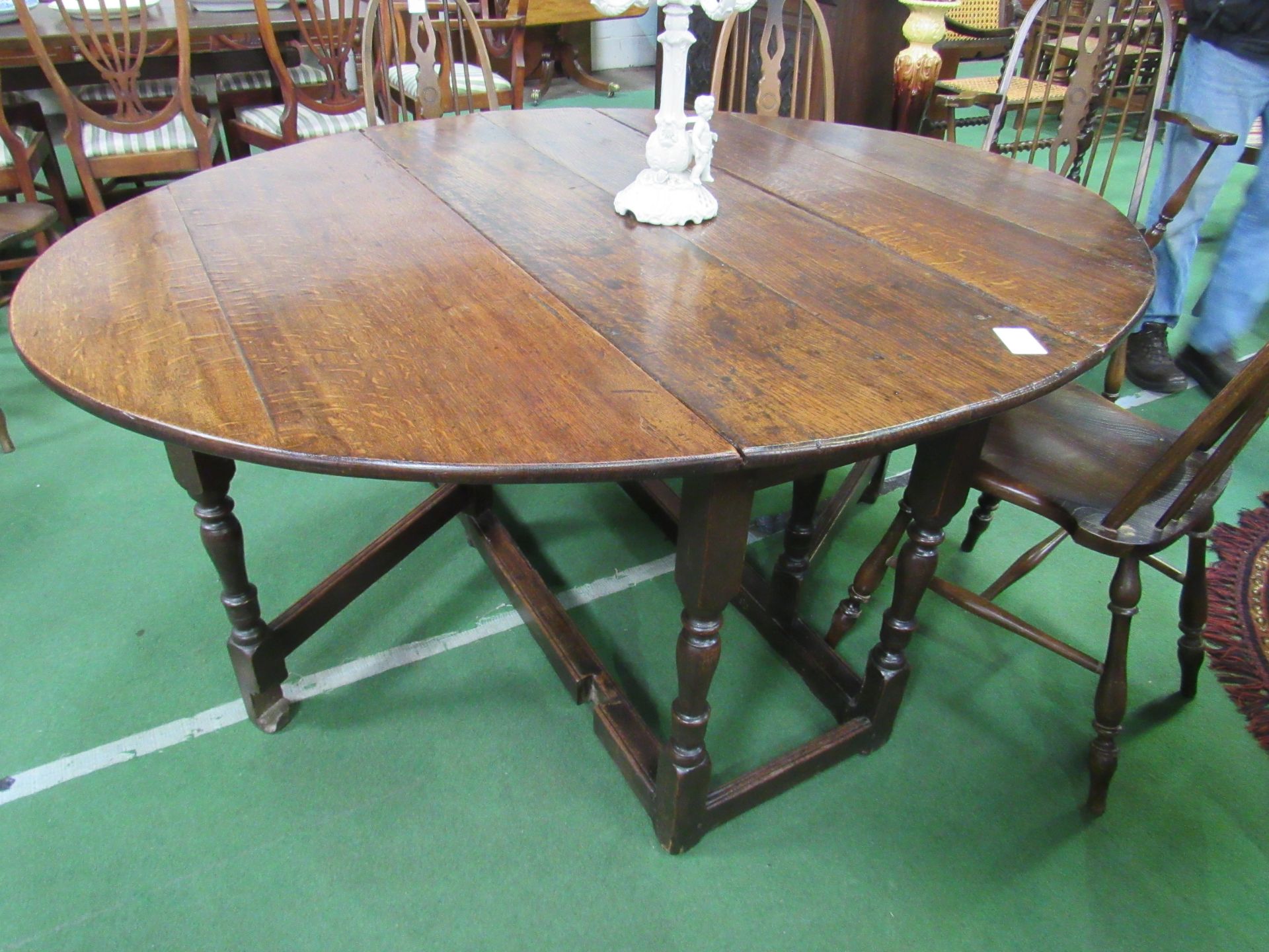 18th Century oak gate-leg table, 160 (open) x 130 x 75cms. Estimate £80-120.