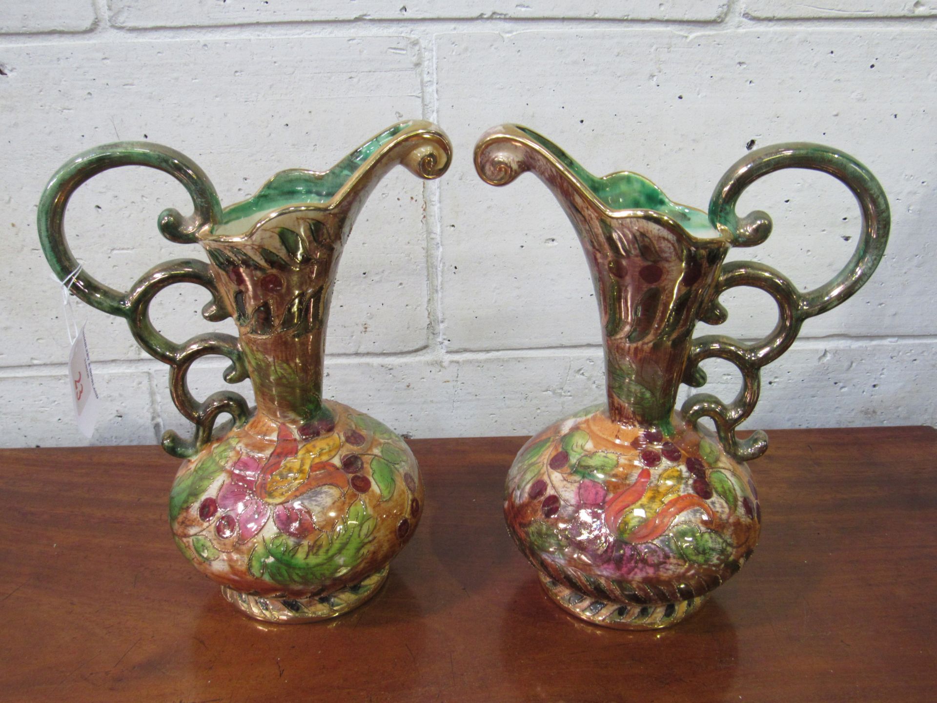 Pair of large Belgian gilded lustre-ware Grecian urn vases, profuse decoration. Estimate £20-30.