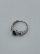 9ct white gold ring with centre green stone and diamonds to shoulder, weight 2.5gm, size O. Estimate